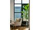 Cozy sitting area with an armchair, side table, and large window with a view at 1 Cool Blow St # 344, Charleston, SC 29403