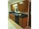 Functional kitchen featuring wood cabinets, black appliances, and a double basin sink at 1010 Foxcroft Rd, Charleston, SC 29412