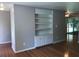 Bright living room with hardwood floors and a built-in bookcase at 1010 Foxcroft Rd, Charleston, SC 29412