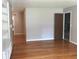 Open-plan living room with gleaming hardwood floors at 1010 Foxcroft Rd, Charleston, SC 29412