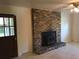 Living area with brick fireplace and a door to the patio at 1010 Foxcroft Rd, Charleston, SC 29412