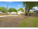 Large backyard with grassy area, fence and storage sheds with some concrete paving at 1014 Alamo St, North Charleston, SC 29405