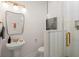 Updated bathroom features a modern vanity, unique mirror, and tiled shower with sleek fixtures at 1014 Alamo St, North Charleston, SC 29405