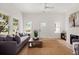 Bright living room featuring hardwood floors, neutral decor, and a cozy seating arrangement at 1014 Alamo St, North Charleston, SC 29405