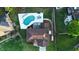 An aerial perspective of a home with a pool, patio, and beautifully landscaped yard at 102 Six Point Ct, Goose Creek, SC 29445