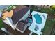 Aerial view of house with pool and patio surrounded by lush greenery on a sunny day at 102 Six Point Ct, Goose Creek, SC 29445