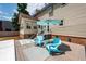 Cozy backyard with an inviting deck, comfortable blue Adirondack chairs, and a serene atmosphere for relaxation at 102 Six Point Ct, Goose Creek, SC 29445