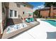 Inviting backyard features a sparkling pool, wooden deck with seating, perfect for outdoor relaxation and entertainment at 102 Six Point Ct, Goose Creek, SC 29445