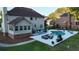 Backyard featuring a sunroom addition, a spacious patio with comfortable seating, and a refreshing pool at 102 Six Point Ct, Goose Creek, SC 29445