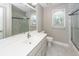 Bathroom featuring a vanity with modern fixtures, tiled floor, and glass-enclosed shower at 102 Six Point Ct, Goose Creek, SC 29445