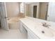 Bathroom with garden tub, white tile floors, vanity with large counter space, and a large mirror at 102 Six Point Ct, Goose Creek, SC 29445
