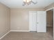 Cozy carpeted bedroom featuring neutral walls, a ceiling fan, and a closet at 102 Six Point Ct, Goose Creek, SC 29445