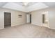 Large Primary bedroom with plush carpeting, tray ceiling and walk-in closet and en-suite bathroom at 102 Six Point Ct, Goose Creek, SC 29445