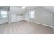 Carpeted bedroom with built-in shelving and natural light filtering through the window, offering ample storage space at 102 Six Point Ct, Goose Creek, SC 29445
