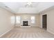 Large main bedroom with fireplace, carpeting, tray ceiling, en-suite bathroom and walk-in closet at 102 Six Point Ct, Goose Creek, SC 29445