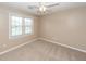 Bright bedroom featuring neutral walls, carpet, ceiling fan, and a sunlit window at 102 Six Point Ct, Goose Creek, SC 29445