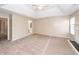 Large main bedroom with plush carpeting, tray ceiling and walk-in closet and en-suite bathroom at 102 Six Point Ct, Goose Creek, SC 29445