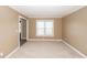 Bright bedroom with neutral carpet and paint and abundant natural light from a large window at 102 Six Point Ct, Goose Creek, SC 29445