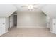 Large carpeted bedroom with neutral walls and a ceiling fan, offering multiple doors for easy access at 102 Six Point Ct, Goose Creek, SC 29445