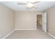 Clean bedroom featuring neutral walls, carpet, a ceiling fan, and an open door at 102 Six Point Ct, Goose Creek, SC 29445