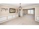 A spacious dining room with a chandelier, decorative wall art, and an adjacent room at 102 Six Point Ct, Goose Creek, SC 29445