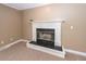 Close up of a fireplace with a white mantel and black tile surround at 102 Six Point Ct, Goose Creek, SC 29445