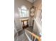 Grand two-story foyer with a modern chandelier, wooden front door, and staircase offering an inviting entrance at 102 Six Point Ct, Goose Creek, SC 29445