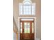 Foyer featuring hardwood floors, natural light, and a grand wooden front door with transom at 102 Six Point Ct, Goose Creek, SC 29445