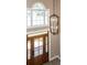 Elegant foyer features a stylish chandelier, a classic wooden door, and a large window for ample natural light at 102 Six Point Ct, Goose Creek, SC 29445