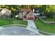 Two-story brick home with an attached garage, a well-manicured lawn, and neatly trimmed hedges at 102 Six Point Ct, Goose Creek, SC 29445