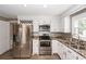Beautifully remodeled kitchen with stainless steel appliances, granite counters, and wine rack at 102 Six Point Ct, Goose Creek, SC 29445
