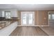 Open kitchen with stainless appliances, granite countertops, and a view to the backyard at 102 Six Point Ct, Goose Creek, SC 29445