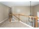 Upstairs landing showing staircase and modern pendant lighting at 102 Six Point Ct, Goose Creek, SC 29445