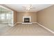 Inviting living room featuring a fireplace and neutral carpeting at 102 Six Point Ct, Goose Creek, SC 29445