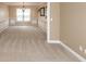 Cozy carpeted living room featuring neutral walls and carpet, molding, chandelier, and window at 102 Six Point Ct, Goose Creek, SC 29445
