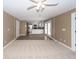 Spacious living room showing kitchen with stainless appliances and access to sunroom at 102 Six Point Ct, Goose Creek, SC 29445