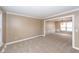 Spacious living room featuring neutral walls and carpet, molding, and chandelier at 102 Six Point Ct, Goose Creek, SC 29445