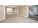 Living room featuring neutral walls and carpet, molding, chandelier, and doorway with wood floors at 102 Six Point Ct, Goose Creek, SC 29445