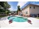 Backyard pool with flower pots and a serene setting at 102 Six Point Ct, Goose Creek, SC 29445