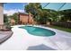 Beautiful backyard pool with lounge chairs and lush landscaping at 102 Six Point Ct, Goose Creek, SC 29445
