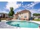 Backyard pool with plenty of lounge space and umbrellas to stay cool at 102 Six Point Ct, Goose Creek, SC 29445