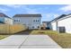 Spacious backyard features green grass, wood fence and concrete patio, creating an outdoor living area at 105 Archdale St, Summerville, SC 29486