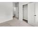 Bright bedroom boasts neutral carpet, a closet and an adjoining room providing ample storage at 105 Archdale St, Summerville, SC 29486
