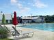 Community pool with lounge chairs and splash features, perfect for summertime relaxation and fun at 105 Archdale St, Summerville, SC 29486
