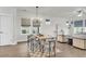 Open dining area with modern furnishings and natural light, seamlessly integrated with the living space at 105 Archdale St, Summerville, SC 29486