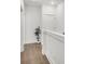 Clean and bright hallway with hardwood floors and fresh white walls, providing ample space at 105 Archdale St, Summerville, SC 29486