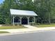 Community mail kiosk with lush landscaping provides a convenient and secure place for mail delivery at 105 Archdale St, Summerville, SC 29486