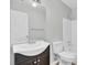 Bright bathroom featuring a modern vanity with an undermount sink, white toilet and shower-tub combo at 108 Greenmeadow Dr, Goose Creek, SC 29445