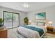 Cozy bedroom with a queen-sized bed, a large window, and sliding glass doors to an exterior balcony at 108 Greenmeadow Dr, Goose Creek, SC 29445