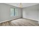 Neutral room with ample natural light, new floors and a large window, awaiting your personal touch and design at 108 Greenmeadow Dr, Goose Creek, SC 29445